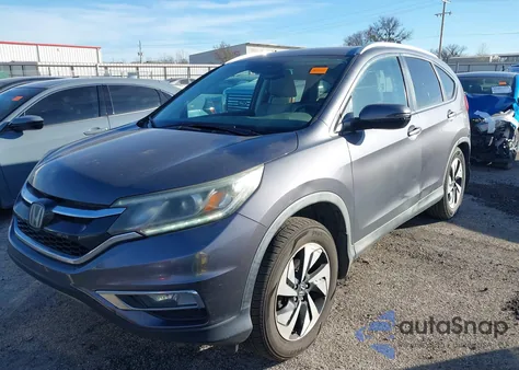 2015 Honda Cr-V Touring z USA, uszkodzony, nr VIN 5J6RM4H98FL129319